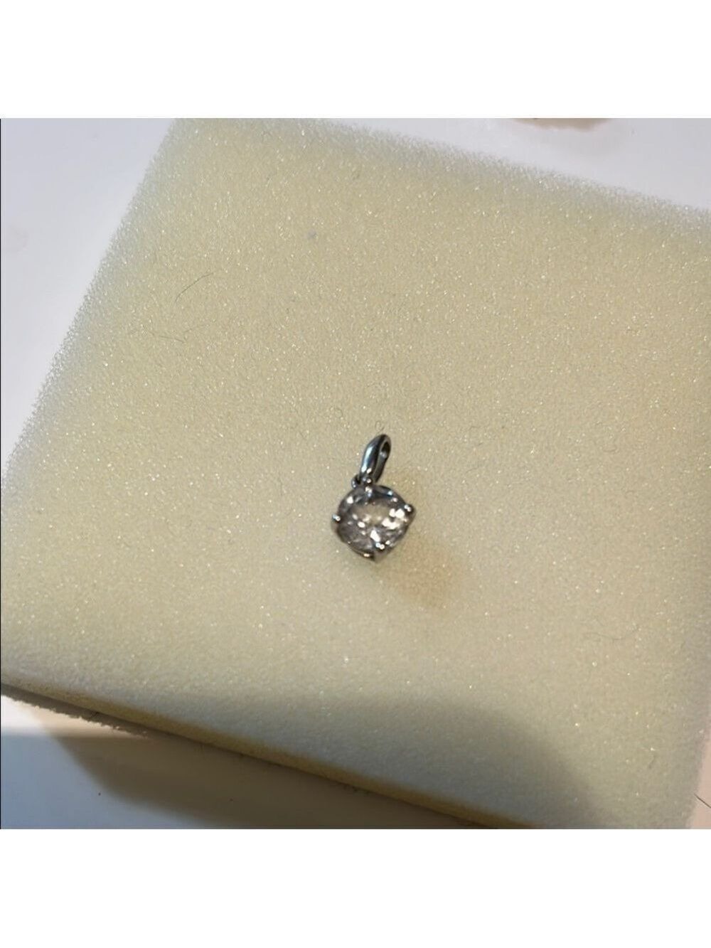 White sapphire and silver pendant